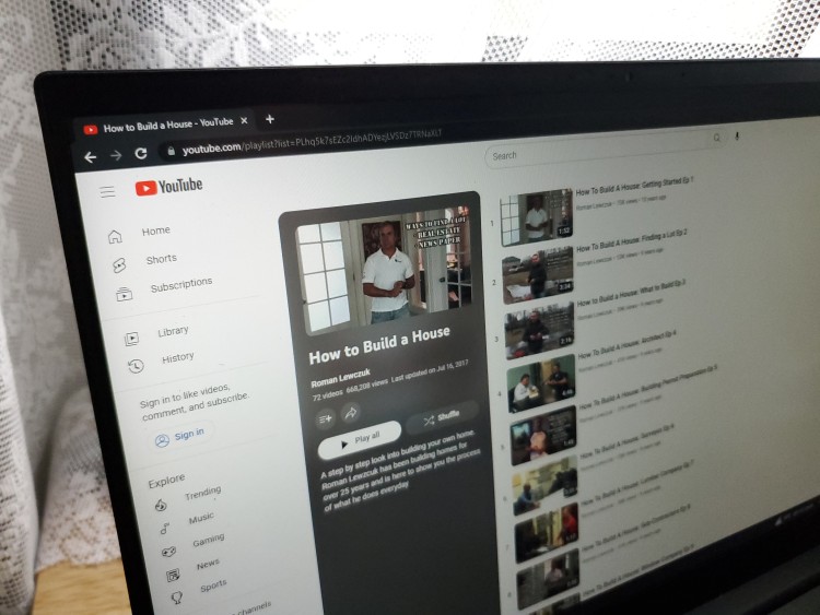 Picture of a laptop screen showing a playlist on Youtube named How to Build a House
